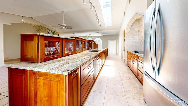40 Sandpiper Dr, Saint Augustine, FL 32080 - kitchen with freestanding refrigerator, rail lighting, a ceiling fan, a sink, and black electric stovetop