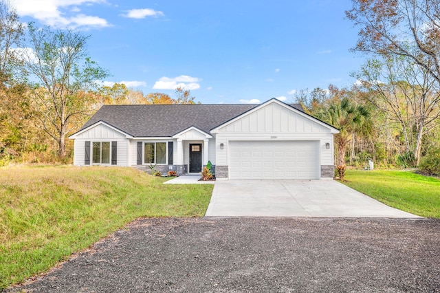 single story home with a front lawn and a garage