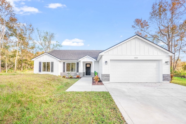 ranch-style house featuring a garage and a front lawn