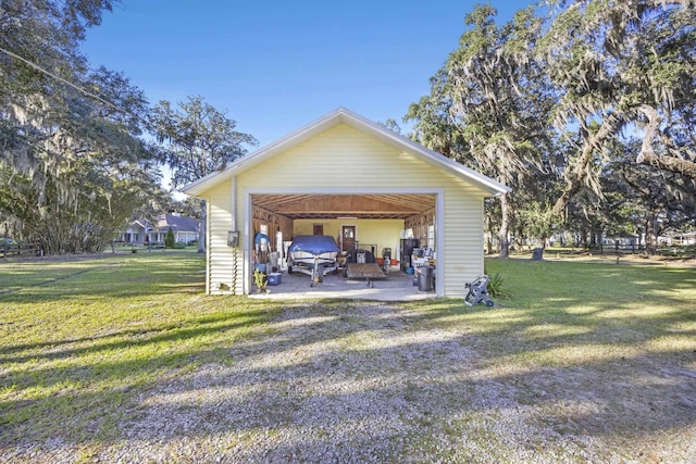 garage featuring a yard