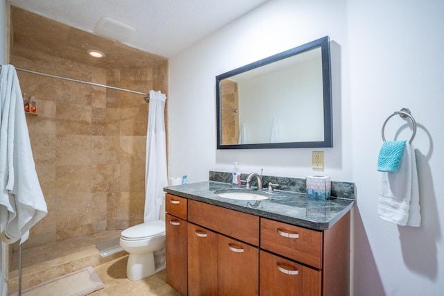 bathroom with a shower with shower curtain, vanity, and toilet