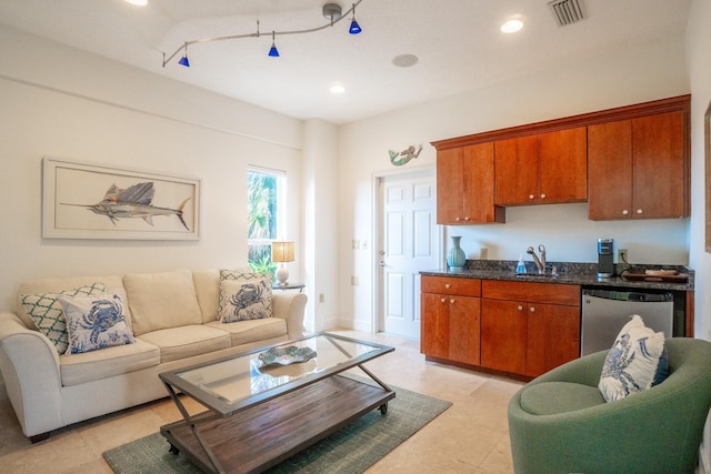 living room featuring sink and rail lighting