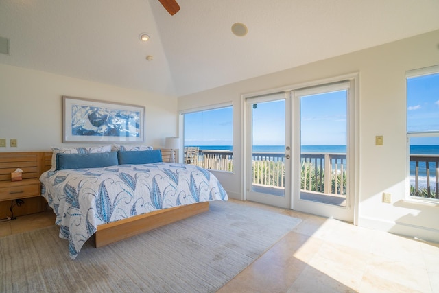 bedroom featuring multiple windows and a water view