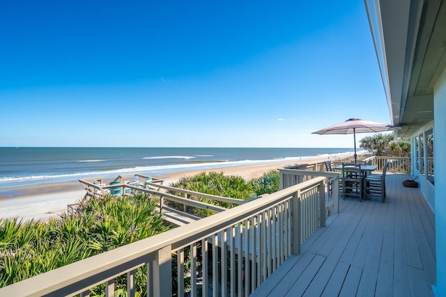 balcony with a view of the beach and a water view