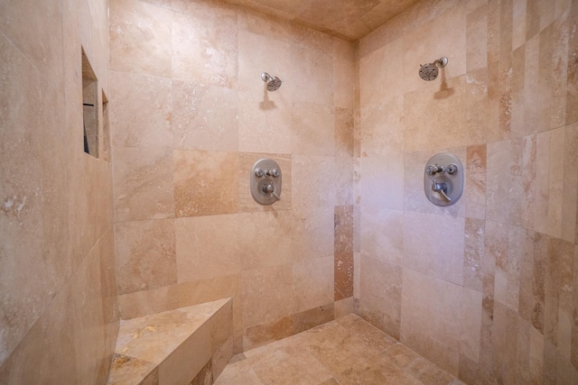 bathroom featuring a tile shower