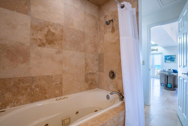 bathroom with tile patterned flooring and shower / tub combo with curtain