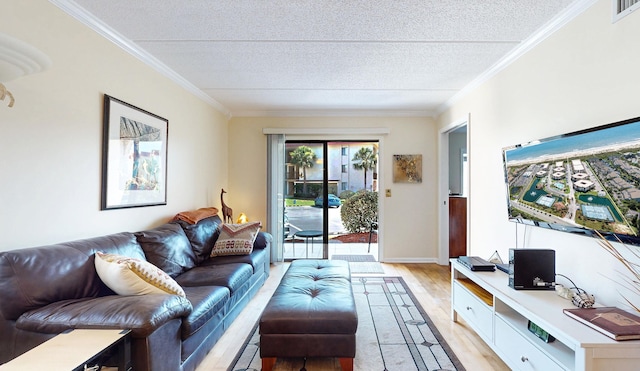  - living room with light wood finished floors, a textured ceiling, ornamental molding, and baseboards