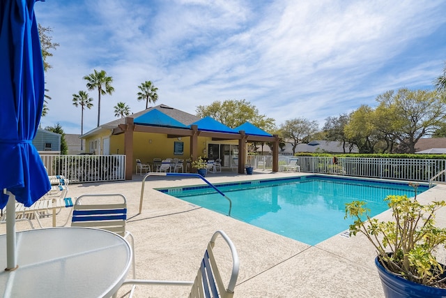 209 Lions Gate Dr, Saint Augustine, FL 32080 - community pool with outdoor dining space, fence, and a patio area