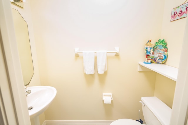 209 Lions Gate Dr, Saint Augustine, FL 32080 - bathroom featuring baseboards, toilet, and a sink
