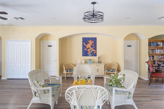 209 Lions Gate Dr, Saint Augustine, FL 32080 - dining room with visible vents, arched walkways, wood finished floors, and ceiling fan