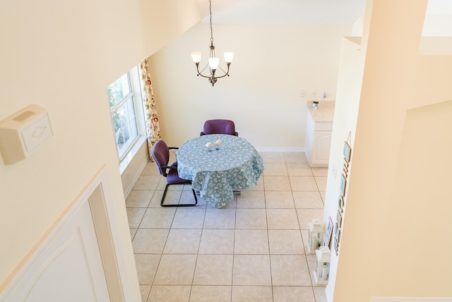 209 Lions Gate Dr, Saint Augustine, FL 32080 - dining space featuring light tile patterned floors, baseboards, vaulted ceiling, and a notable chandelier
