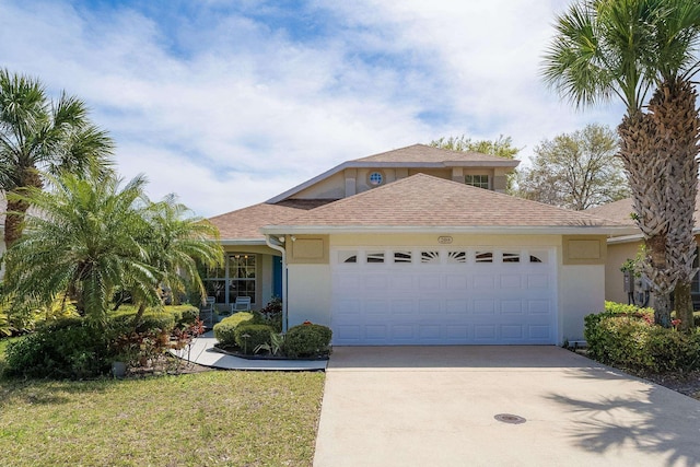 209 Lions Gate Dr, Saint Augustine, FL 32080 - view of front of property with stucco siding, an attached garage, a shingled roof, and concrete driveway