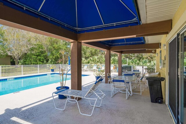 209 Lions Gate Dr, Saint Augustine, FL 32080 - view of patio / terrace featuring a community pool and fence