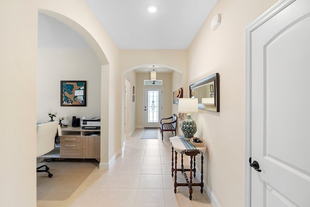 21 Park Place Cir, Palm Coast, FL 32164 - foyer entrance featuring arched walkways, baseboards, and light tile patterned floors