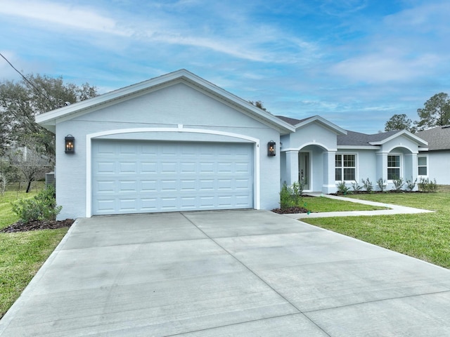 single story home with a garage, driveway, and a front yard