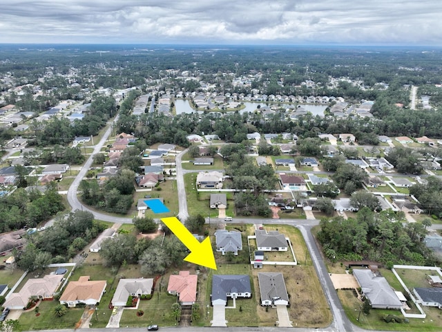 birds eye view of property with a residential view