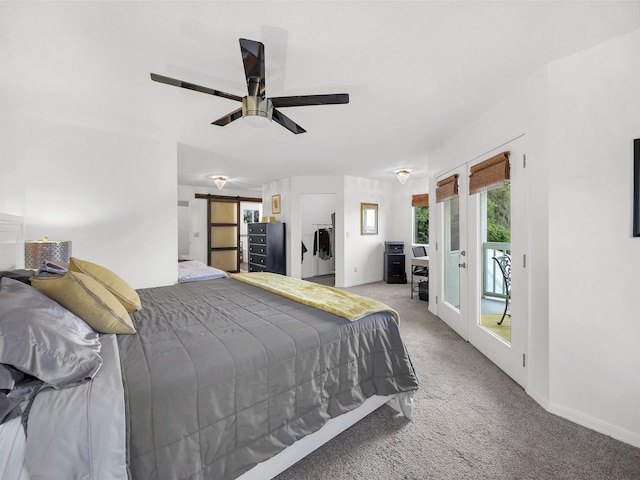 10 Seminole Dr, Saint Augustine, FL 32084 - bedroom with light carpet, access to outside, baseboards, a ceiling fan, and a barn door