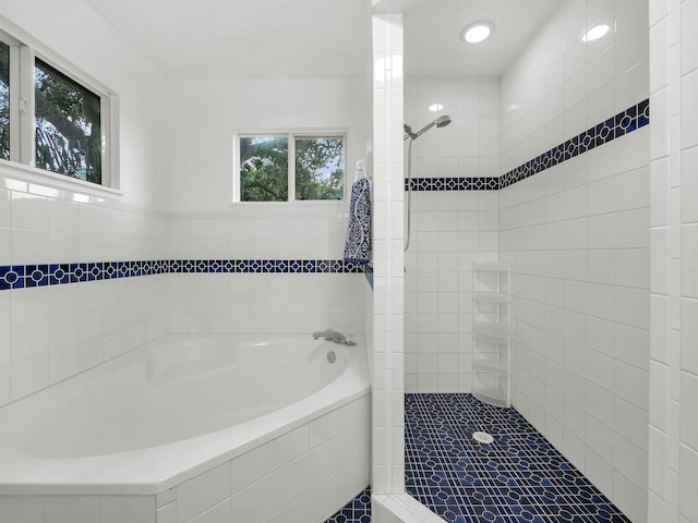 10 Seminole Dr, Saint Augustine, FL 32084 - bathroom featuring a bath, tiled shower, recessed lighting, and tile patterned flooring