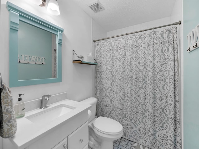 10 Seminole Dr, Saint Augustine, FL 32084 - bathroom featuring vanity, toilet, a textured ceiling, and a shower with curtain