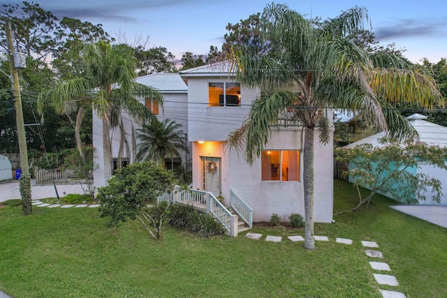 10 Seminole Dr, Saint Augustine, FL 32084 - view of front of property with stucco siding and a front lawn