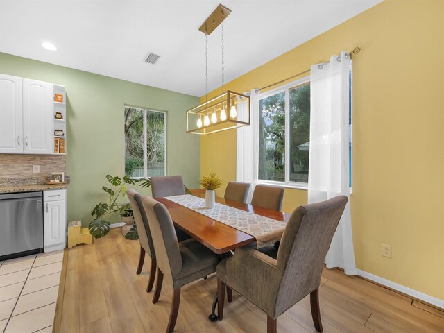 10 Seminole Dr, Saint Augustine, FL 32084 - dining area featuring light wood-style flooring, baseboards, recessed lighting, and a chandelier