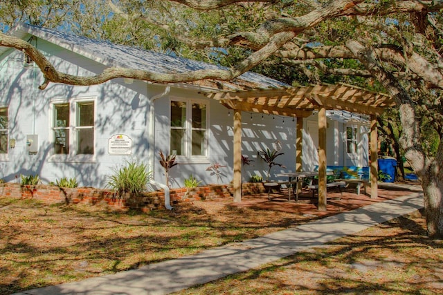 136 Lawn Ave, Saint Augustine, FL 32084 - view of front of home featuring a pergola
