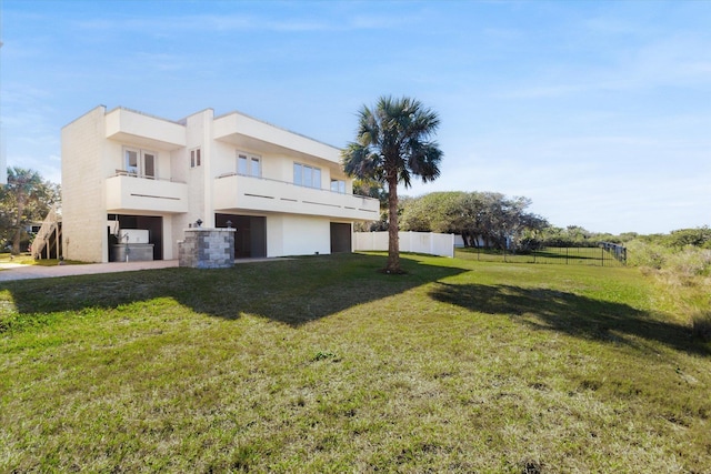 136 Lawn Ave, Saint Augustine, FL 32084 - view of side of home featuring stucco siding and a garage
