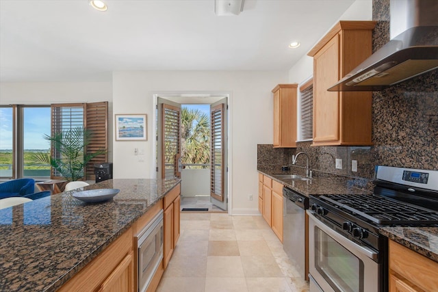 136 Lawn Ave, Saint Augustine, FL 32084 - kitchen with appliances with stainless steel finishes, wall chimney exhaust hood, plenty of natural light, backsplash, and recessed lighting