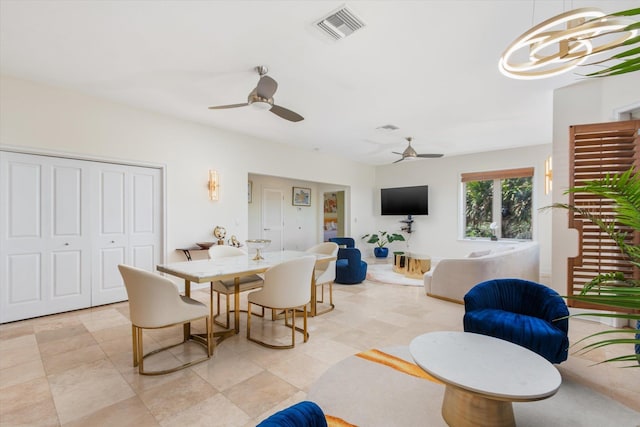 136 Lawn Ave, Saint Augustine, FL 32084 - dining area featuring ceiling fan and a chandelier