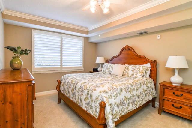 bedroom with ornamental molding, ceiling fan, and light carpet