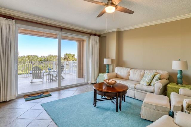 tiled living room featuring ceiling fan, crown molding, and a textured ceiling