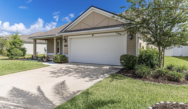 view of front facade with a garage and a front yard