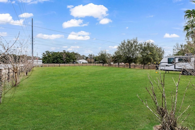 view of yard with a rural view