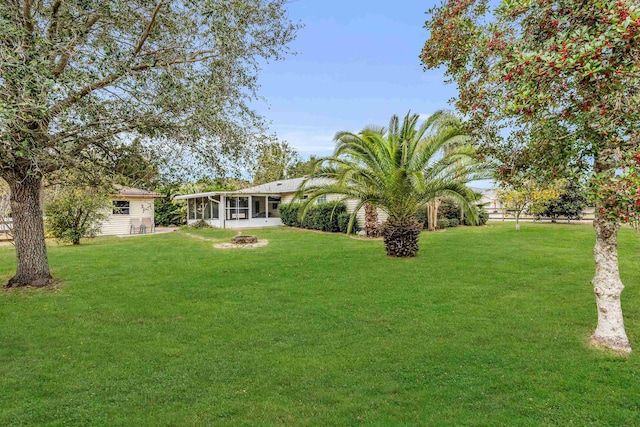 view of yard with a sunroom