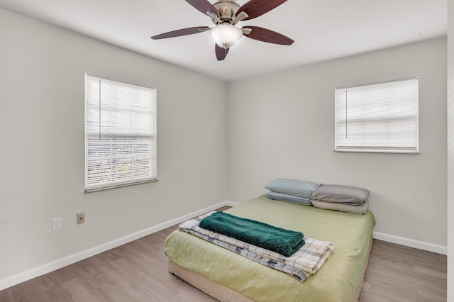 bedroom featuring ceiling fan and light wood-type flooring