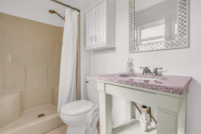 bathroom with toilet, vanity, tile patterned floors, and a shower with curtain