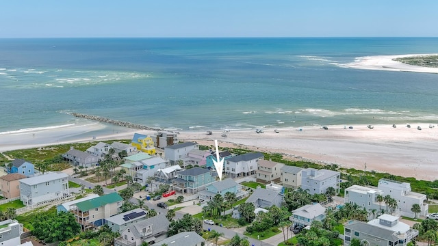 bird's eye view featuring a water view and a beach view