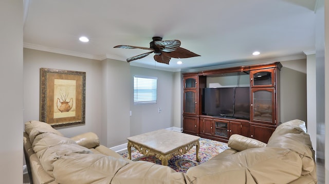 living room with ceiling fan and crown molding