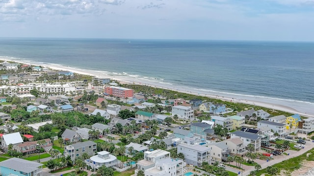 aerial view with a water view and a beach view