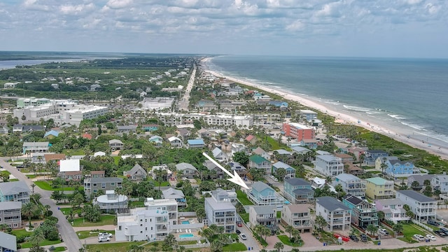 birds eye view of property featuring a water view and a view of the beach