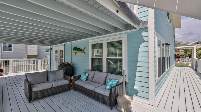 deck featuring outdoor lounge area, area for grilling, and french doors