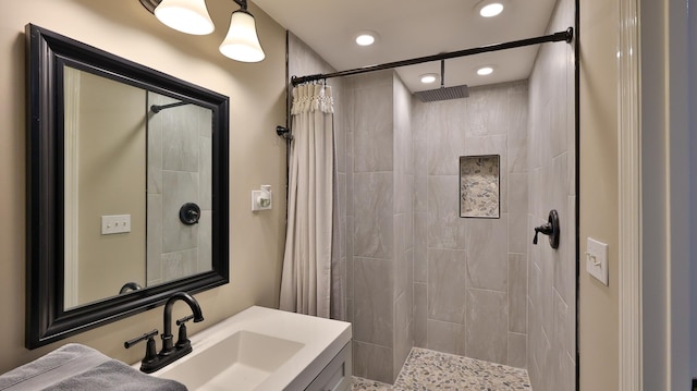 bathroom featuring curtained shower and vanity