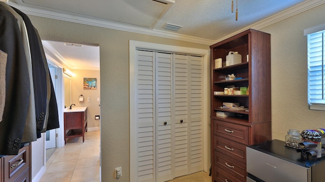 interior space featuring sink and light tile patterned floors