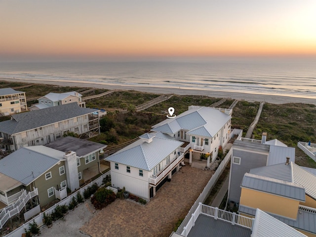 aerial view at dusk with a water view