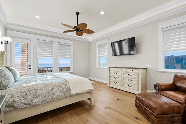 bedroom with crown molding, ceiling fan, and light hardwood / wood-style flooring