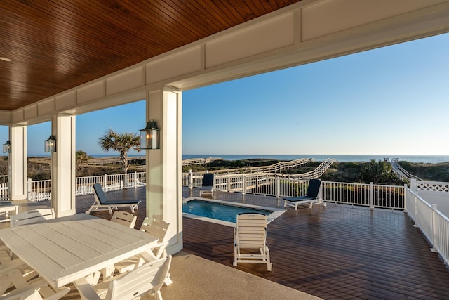 view of patio featuring a fenced in pool and a water view