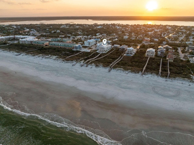 aerial view at dusk with a water view