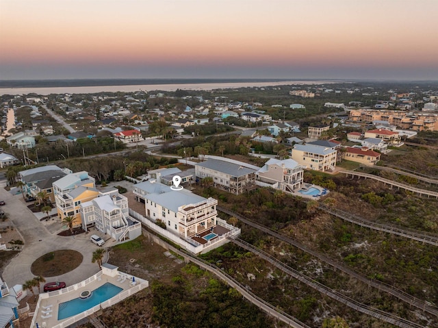 aerial view at dusk with a water view