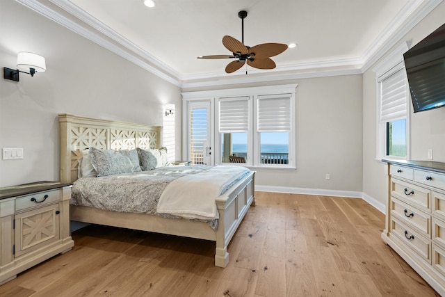 bedroom with crown molding, ceiling fan, and light hardwood / wood-style floors