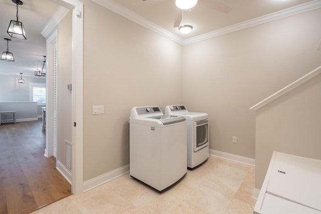 washroom with crown molding, independent washer and dryer, and ceiling fan